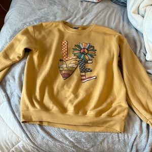 Cute yellow sweatshirt that says “Love”